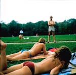 Joel D. Levinson - Untitled #56 (Man in Dark Glasses Looking over Women)
Click for more Images